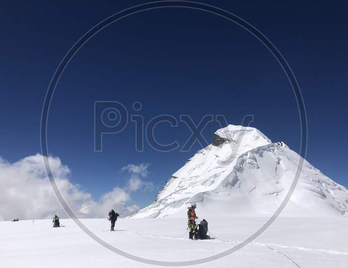 Mountaineers walking roped up at 6000 mtrs. Mountain photography