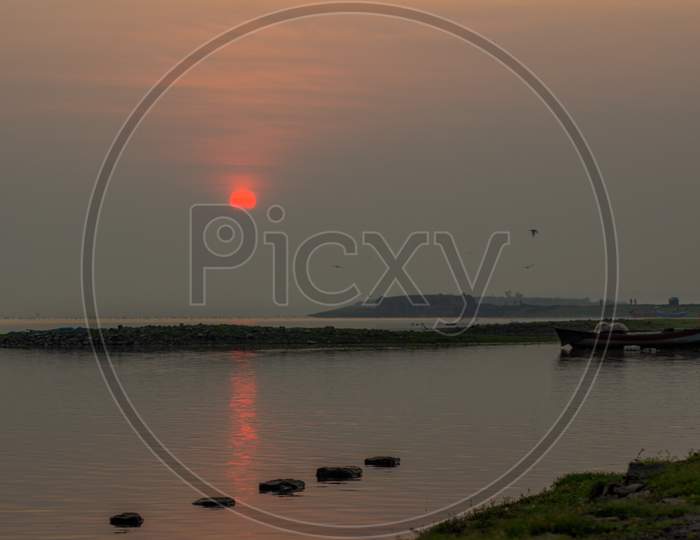 pebbles and stones in river sunrise view