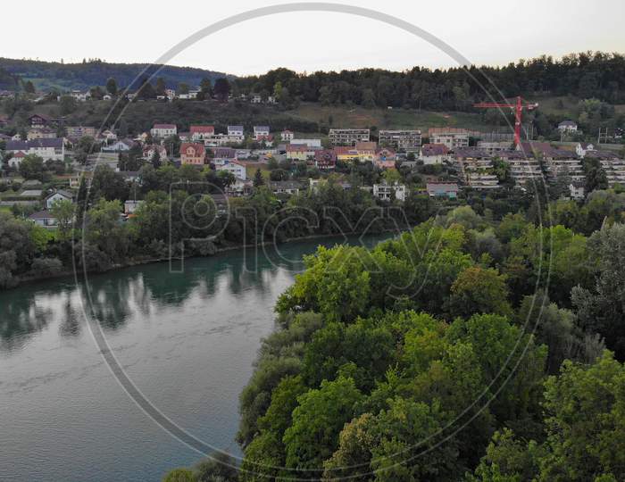 Aerial View Over Aare River, The Train Bridge Of Brugg And Residential Area Of Umikenand Riniken, Switzerland.