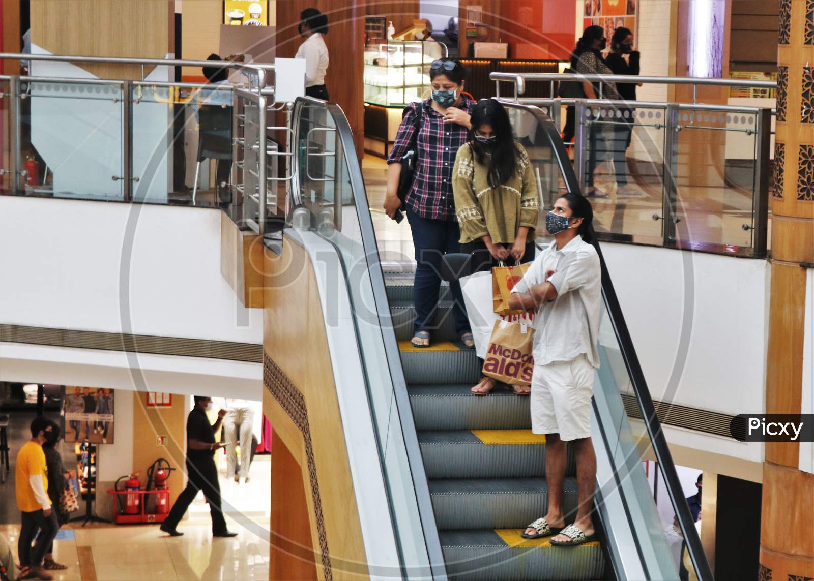 People are seen at a shopping mall amidst the spread of the coronavirus disease (COVID-19) in Mumbai, India on October 13, 2020.