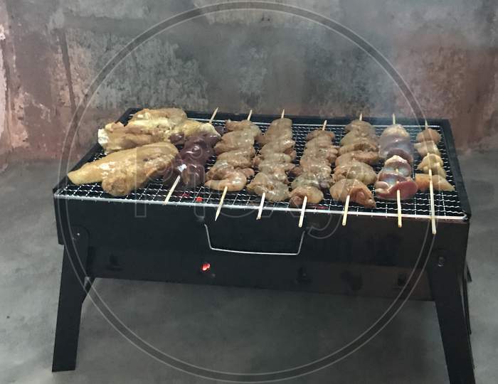 barbecue grill with smoke and flames