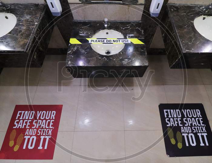 A wash basin is blocked to maintain social distancing at a toilet inside a shopping mall amidst the spread of the coronavirus disease (COVID-19) in Mumbai, India on October 13, 2020.