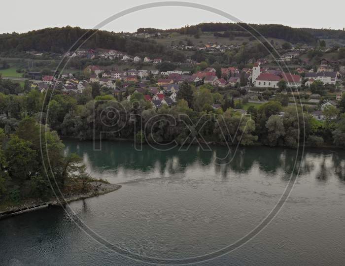 Aerial View Over Aare River, To The Church And Residential Area Of Umiken And Riniken, Switzerland.