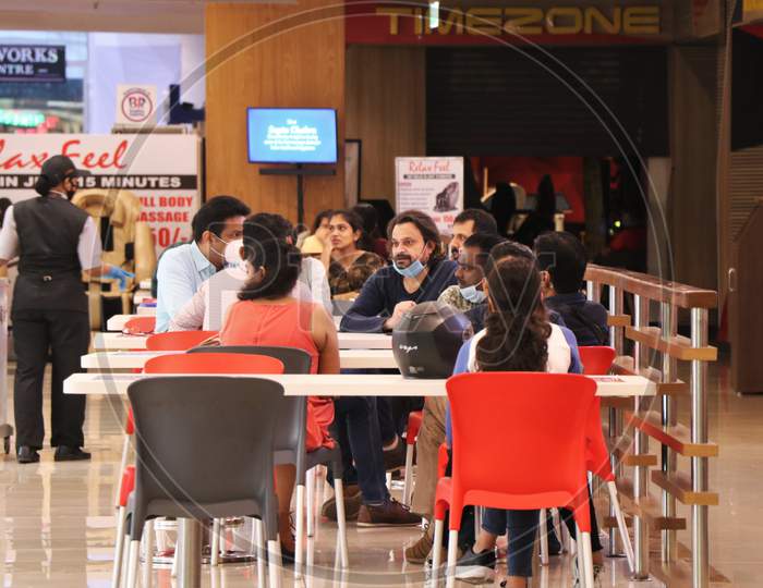 People eat at a food court at a mall after they reopened amidst the spread of the coronavirus disease (COVID-19) in Mumbai, India on October 13, 2020.