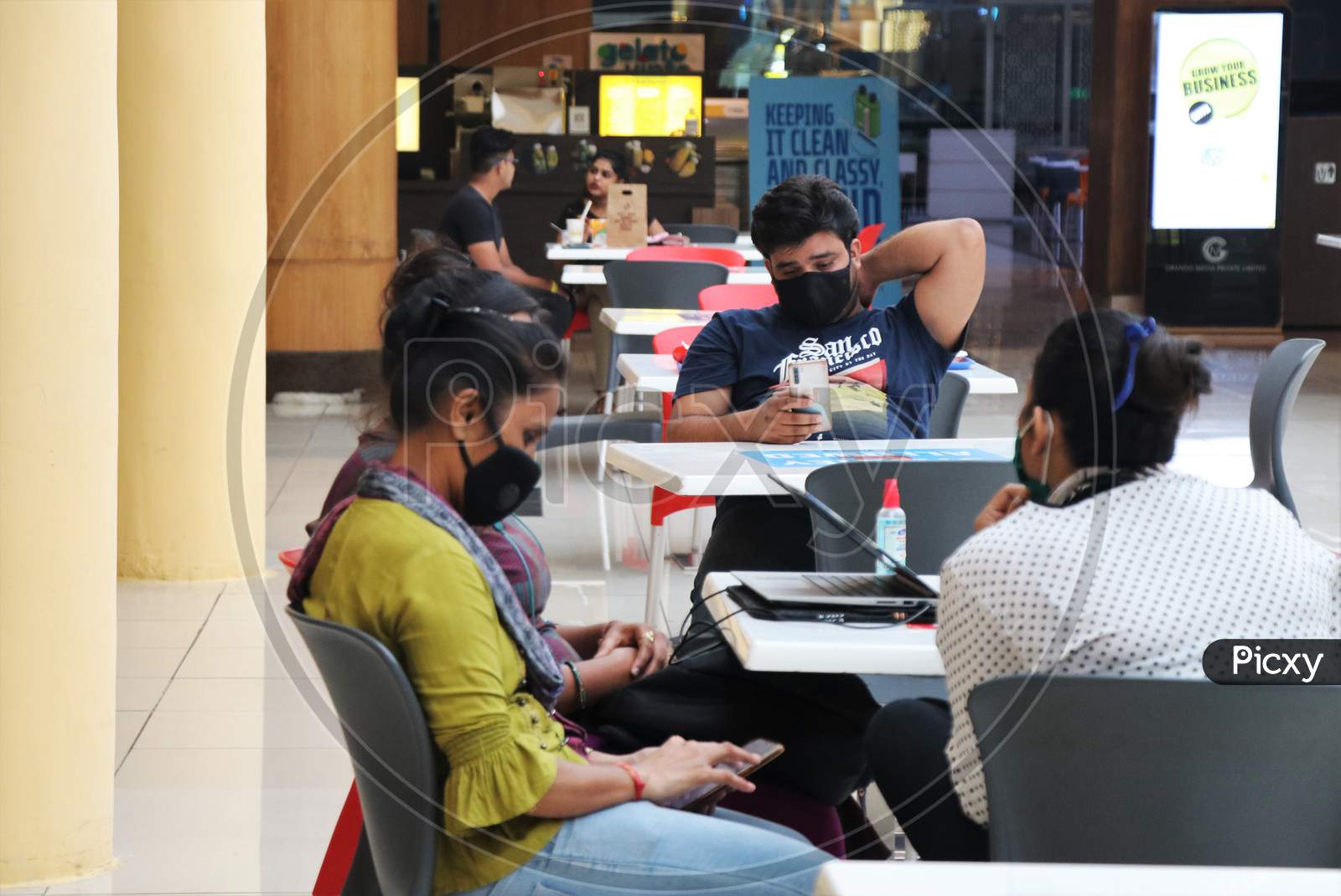 People are seen at a food court at a mall after they reopened amidst the spread of the coronavirus disease (COVID-19) in Mumbai, India on October 13, 2020.