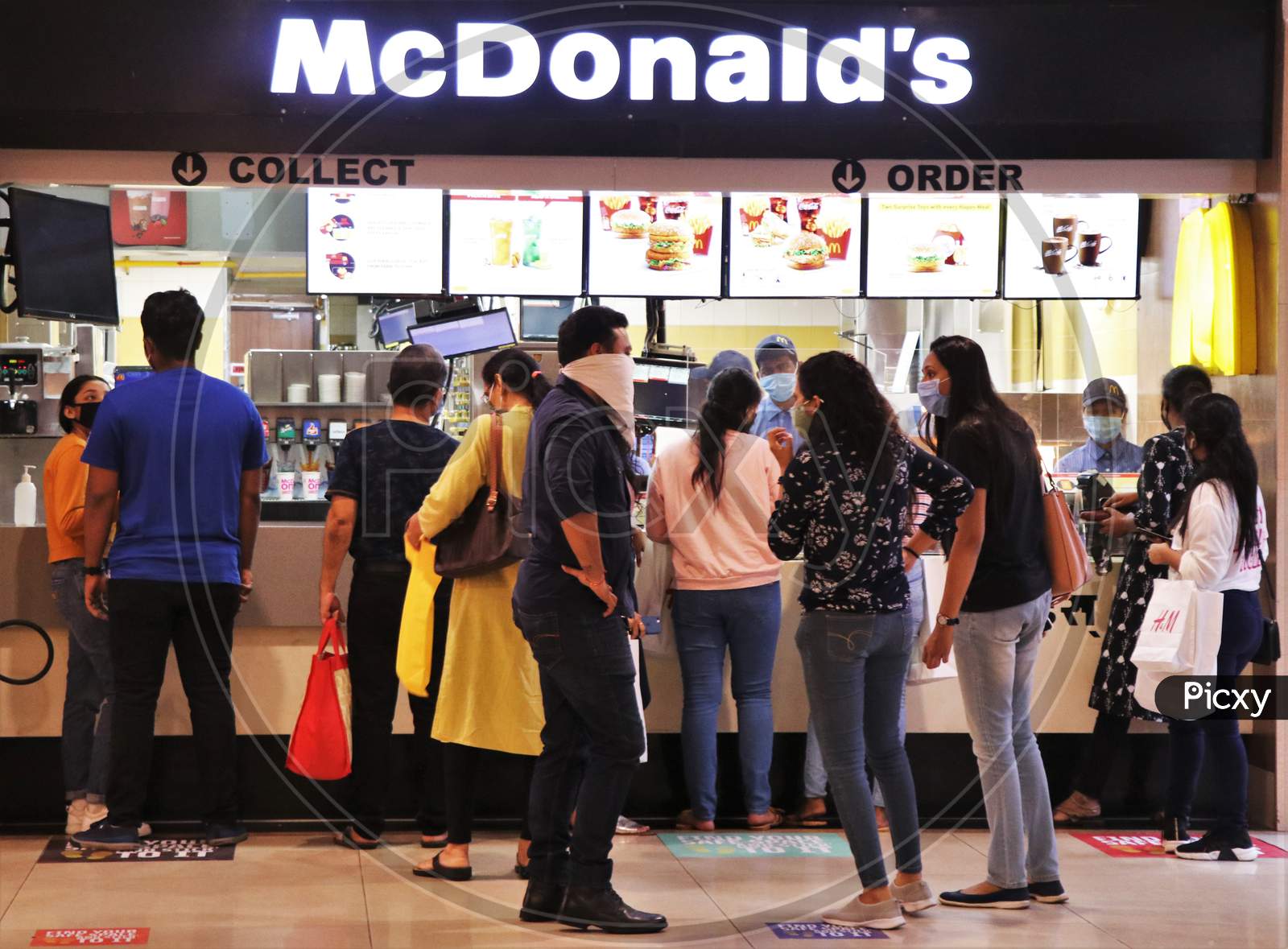 People are seen at a food court at a mall after they reopened amidst the spread of the coronavirus disease (COVID-19) in Mumbai, India on October 13, 2020.