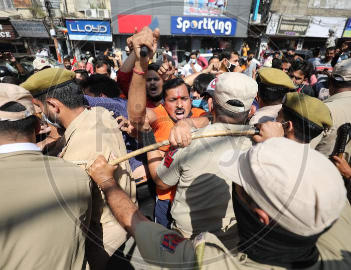 Rashtriya Bajrang Dal activists raise slogans during a protest against 'derogatory remarks' by Jammu & Kashmir National Conference President Farooq Abdullah regarding Article 370, in Jammu, , Oct. 14, 2020.