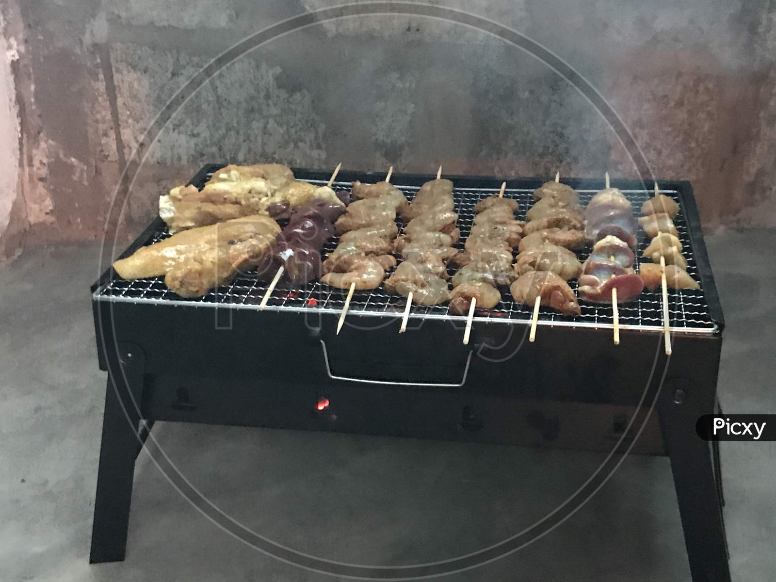 barbecue grill with smoke and flames