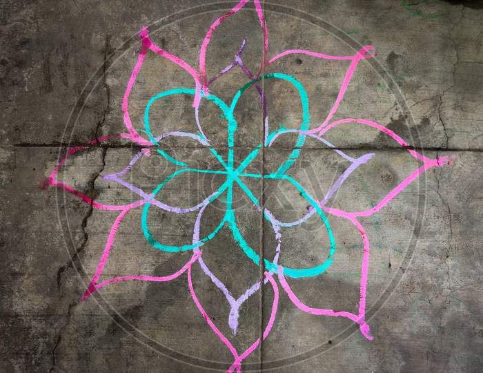 Colorful Flower Kolam Drawn Using Color Chalk Pieces. In Front Of South Indian Home. Festival Time Concept.