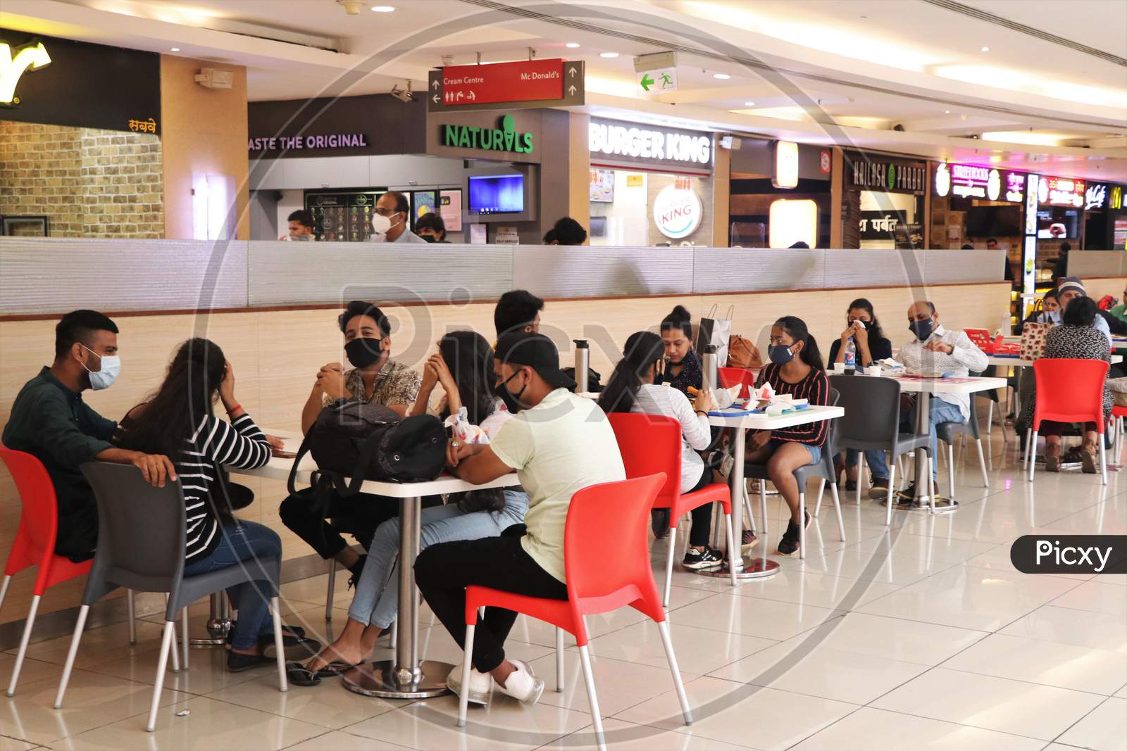 People eat at a food court at a mall after they reopened amidst the spread of the coronavirus disease (COVID-19) in Mumbai, India on October 13, 2020.