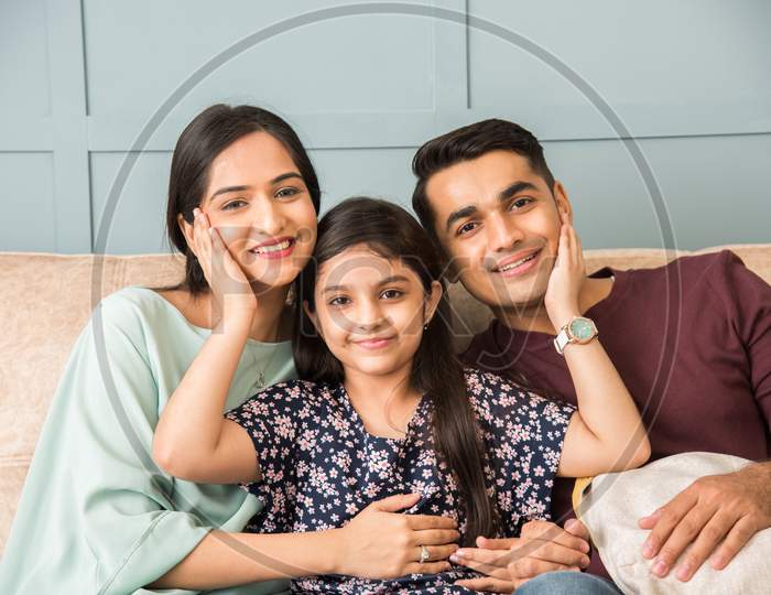 Portrait Of Happy Asian Indian Young Family. Mother, Father Daughters And Son