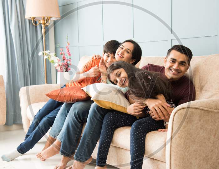 Portrait Of Happy Asian Indian Young Family. Mother, Father Daughters And Son