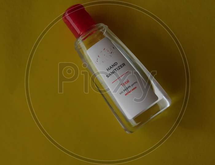 Closeup Of A Sanitizer Bottle Isolated On Yellow Background