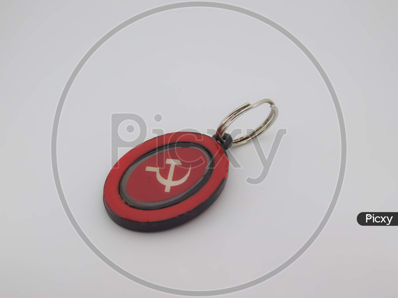 Closeup Of A Red Object Attached With Ring Isolated On White Background