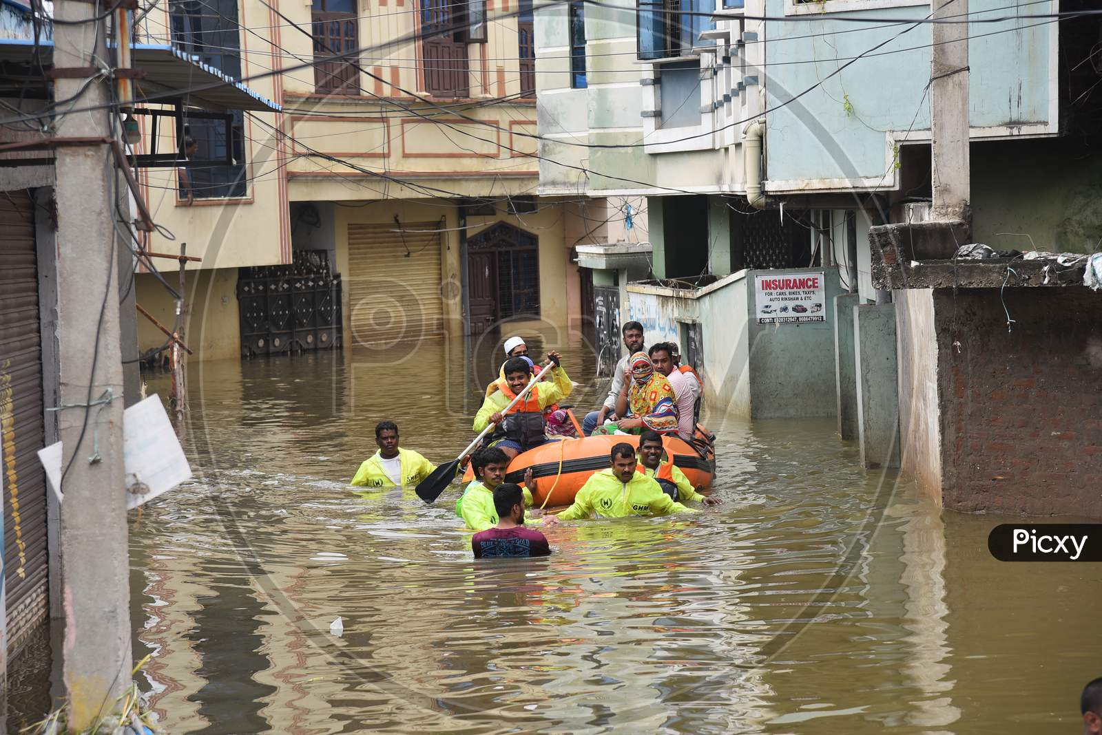 GHMC DRF teams rescue flood affected families in Al-Jubail Colony of Falaknuma in Hyderabad on October 14, 2020.