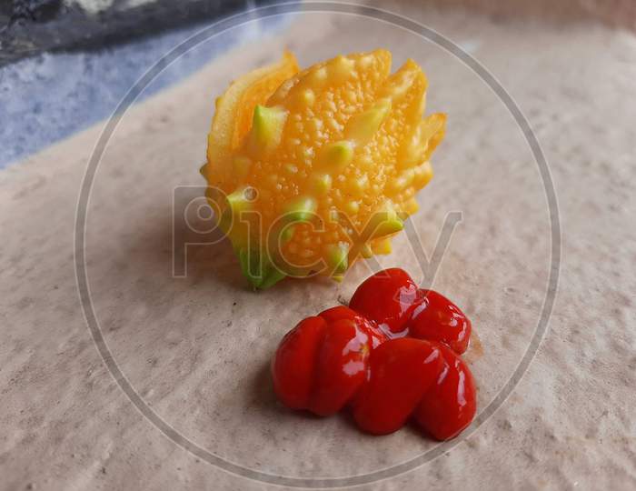 YELLOW BITTER MELON AND RED SEEDS