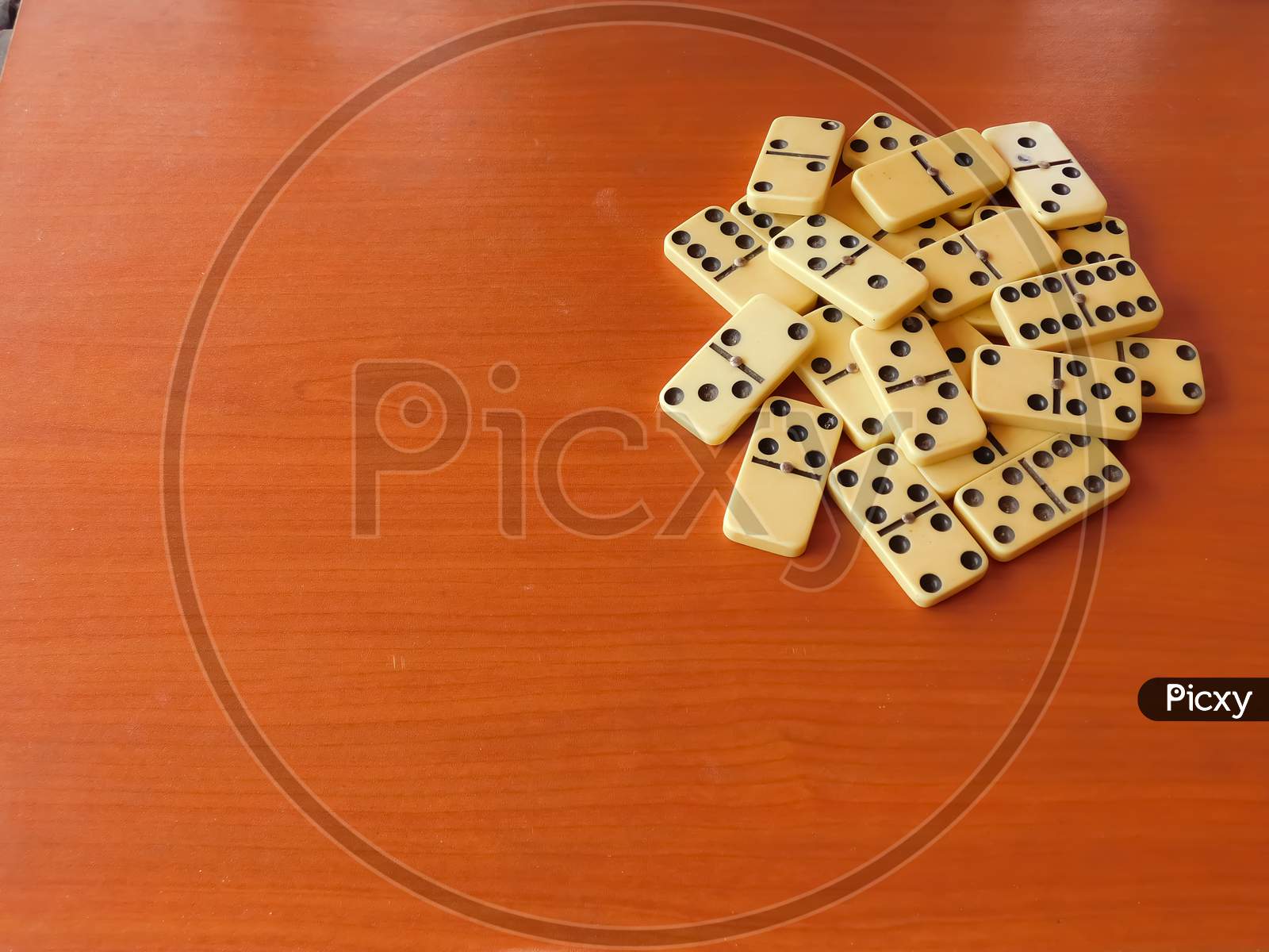 Closeup Of Playing Items(Dominoes)Isolated On Wooden Surface
