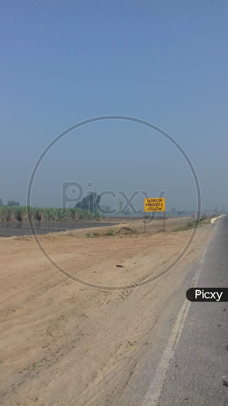 Road construction work in farms - image