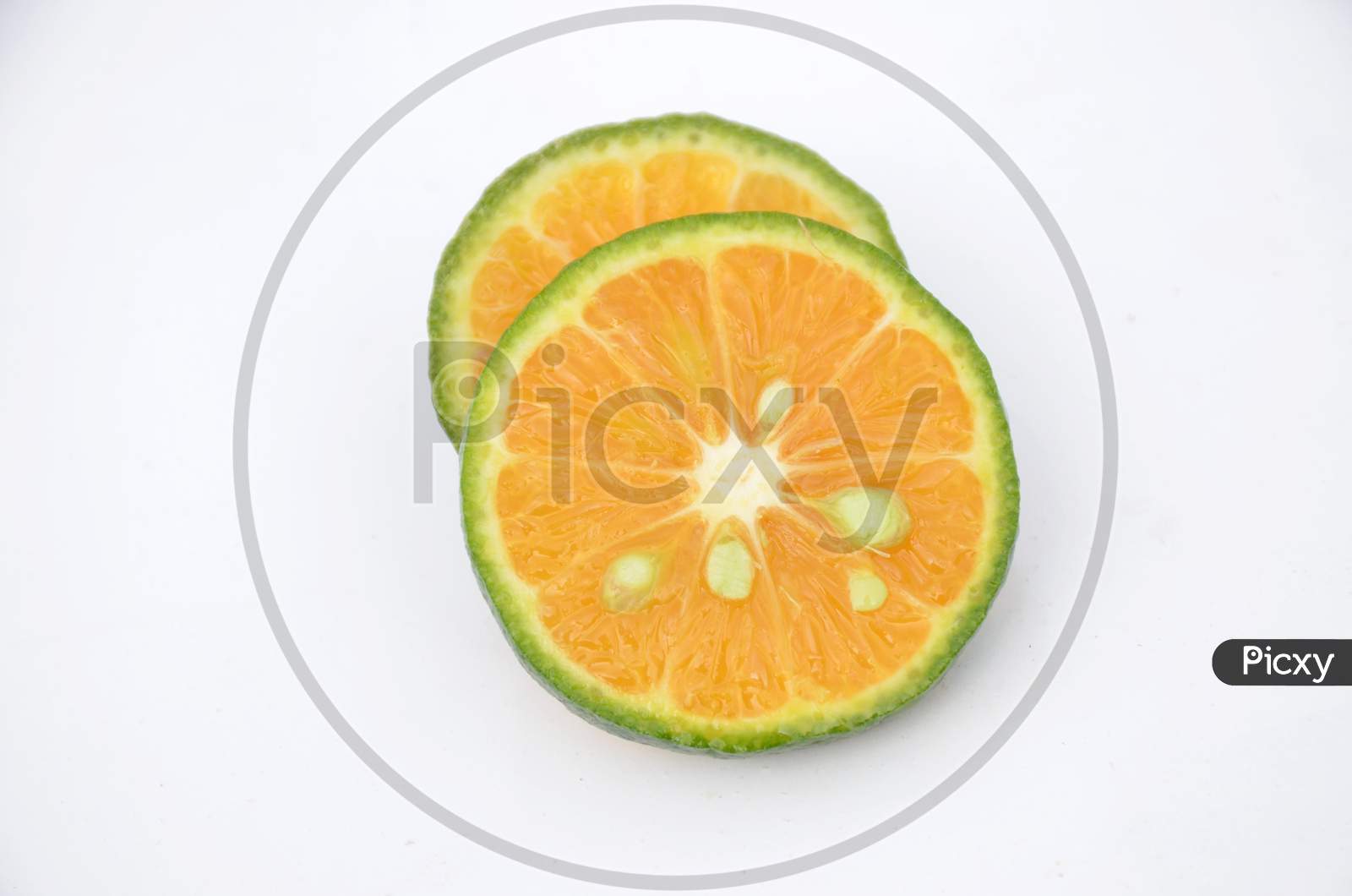 Sliced Orange Fruit Isolated On White Background.