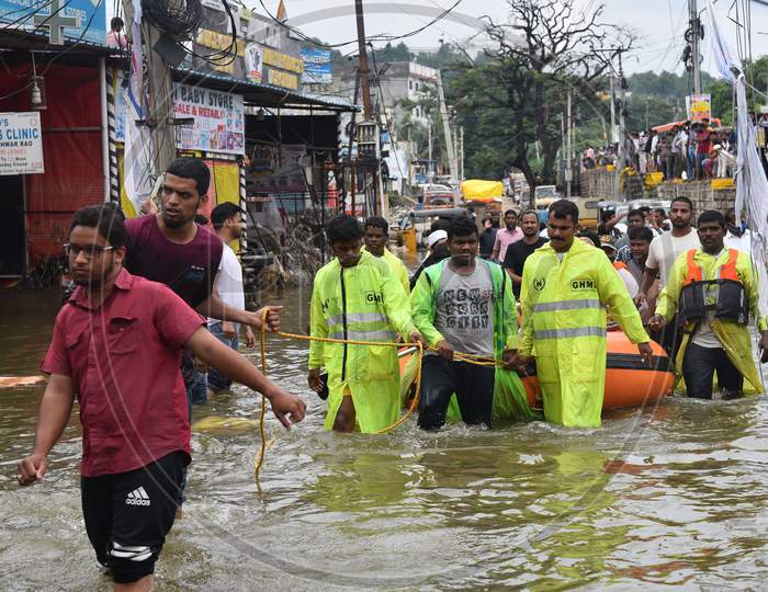 GHMC DRF teams rescue flood affected families in Al-Jubail Colony of Falaknuma in Hyderabad on October 14, 2020.