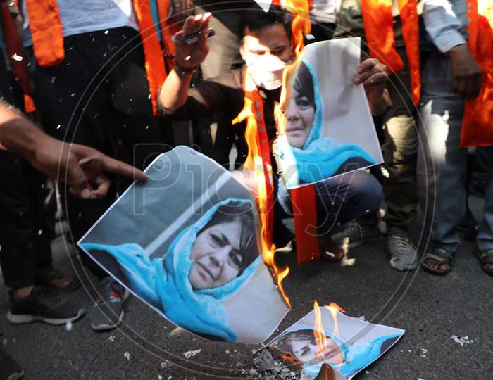 Shiv Sena Dogra Front activists holding a protest and burn the poster of former chief minister Mehbooba Mufti, who was released after over 14 months detention, in Jammu ,15 oct,2020.