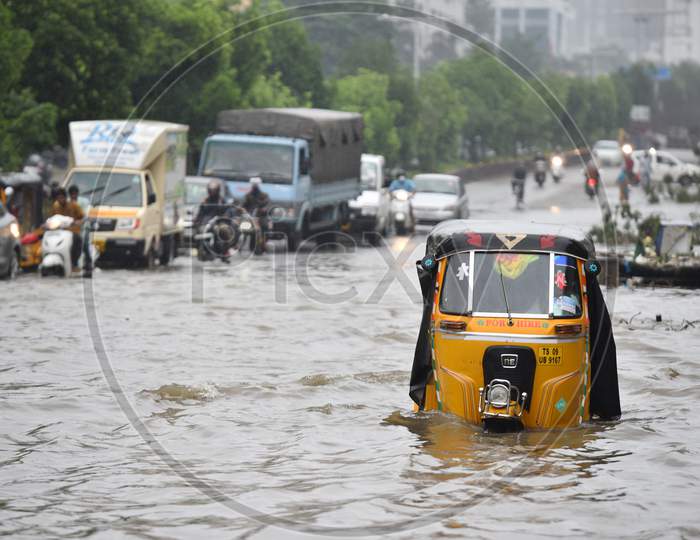 An auto rickshaw stuck in a flood caused by rain water in Tolichowki on October 14,2020, Hyderabad.