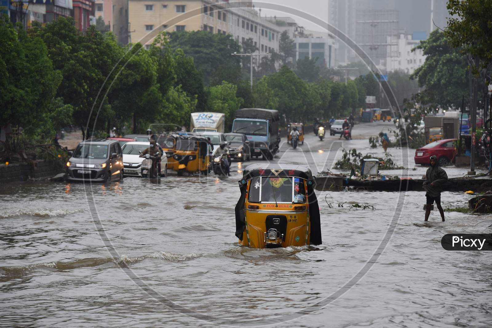 An auto rickshaw stuck in a flood caused by rain water in Tolichowki on October 14,2020, Hyderabad.