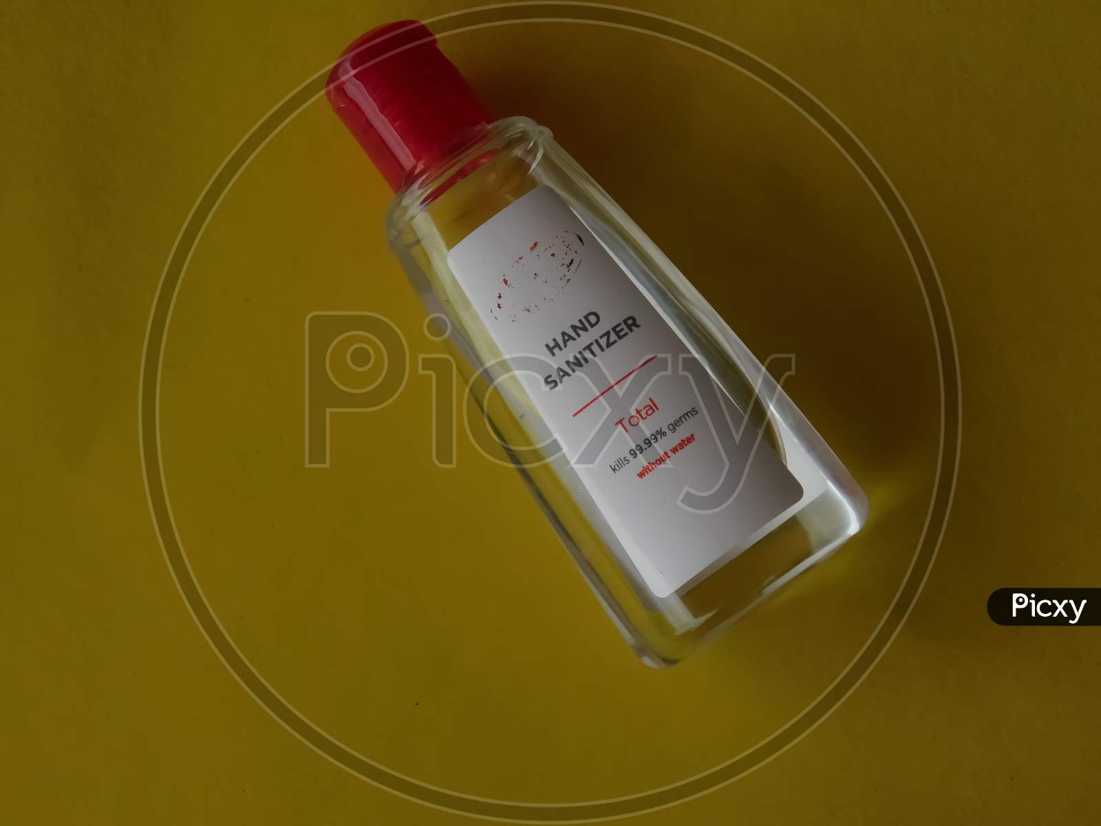 Closeup Of A Sanitizer Bottle Isolated On Yellow Background