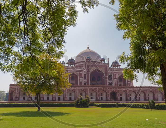 Humayun Tomb with some green tree branches