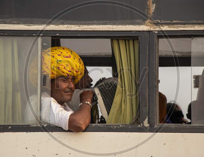 A traditional Rajasthani man with a yellow turban