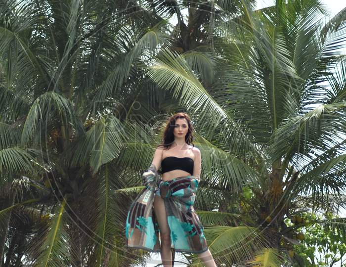 Woman in swimsuit dress in the tropics