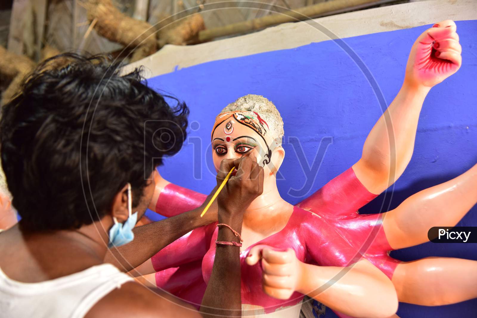 Guwahati: An artist gives final touches to an idol of Goddess Durga ahead of Durga Puja festival, in Guwahati, on Oct 16,2020