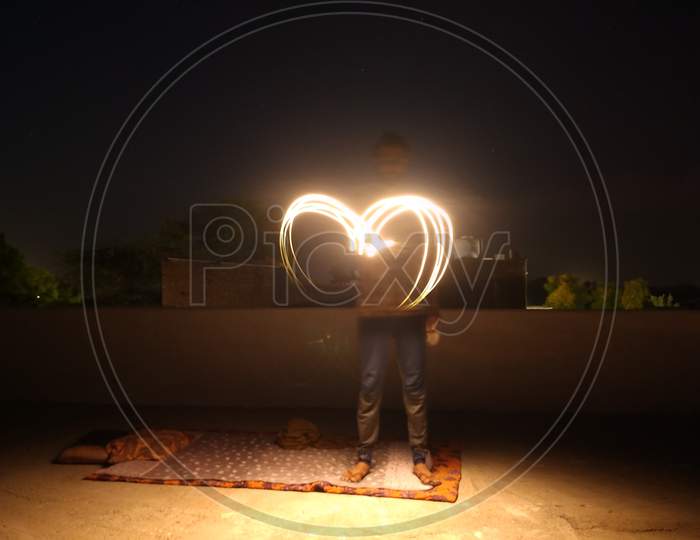 Heart shape long exposure photo at night