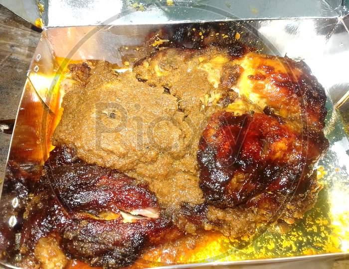 Grilled Chicken Food In Packet. Espicy Curry. Fried Chicken Meat Cutlet Rosy Cutlet Is Close.Barbecue Chicken Consists Of Chicken Parts Or Entire Chickens That Are Barbecued, Grilled. Indian Aisan.
