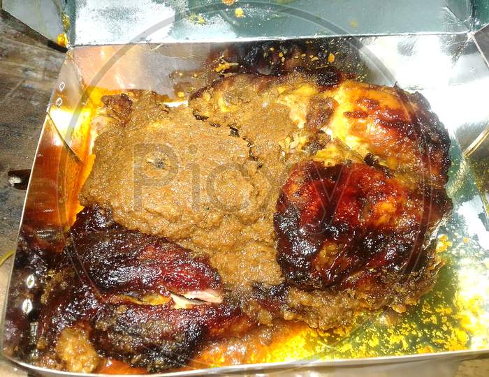 Grilled Chicken Food In Packet. Espicy Curry. Fried Chicken Meat Cutlet Rosy Cutlet Is Close.Barbecue Chicken Consists Of Chicken Parts Or Entire Chickens That Are Barbecued, Grilled. Indian Aisan.