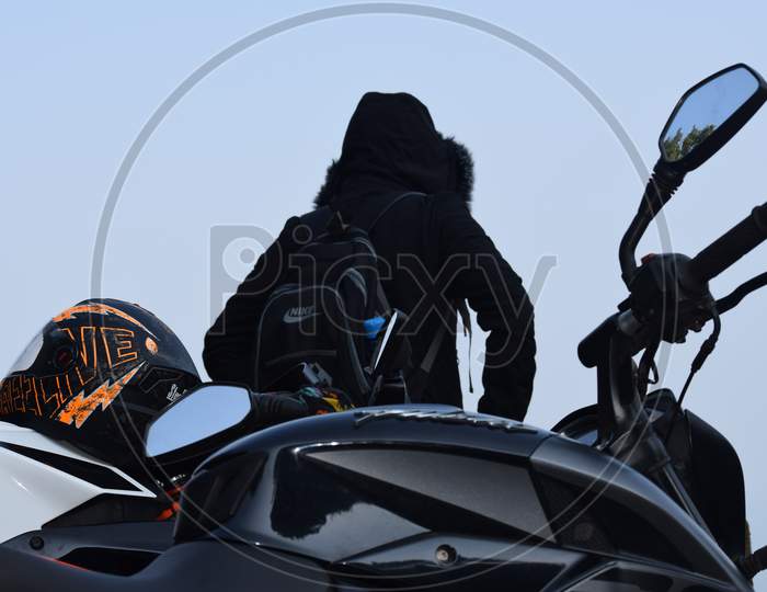 Closeup Of A Motorcycle Near The Rider