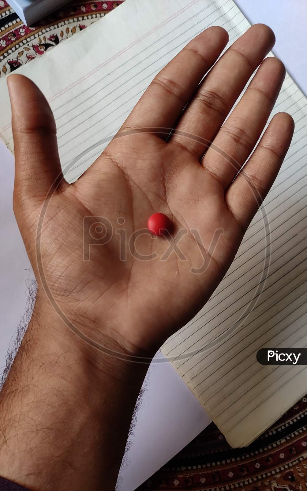 Red Pill in a Hand photo