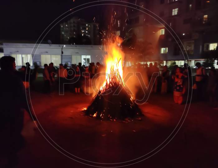 Chennai - india /TN - March 2020: people performing holika dahan the night before Holi festival
