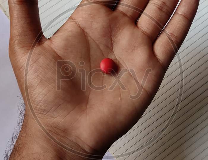 Red Pill in a Hand photo
