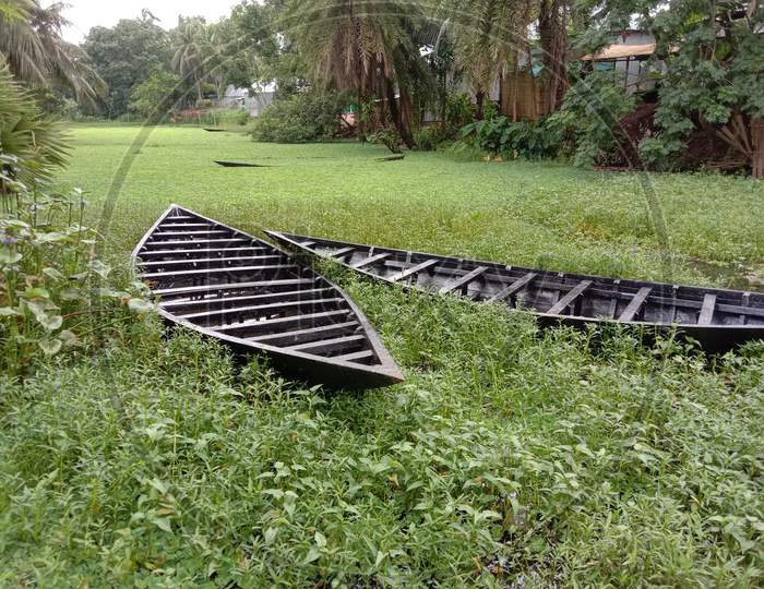 Black Color Wooden Boat With Nature