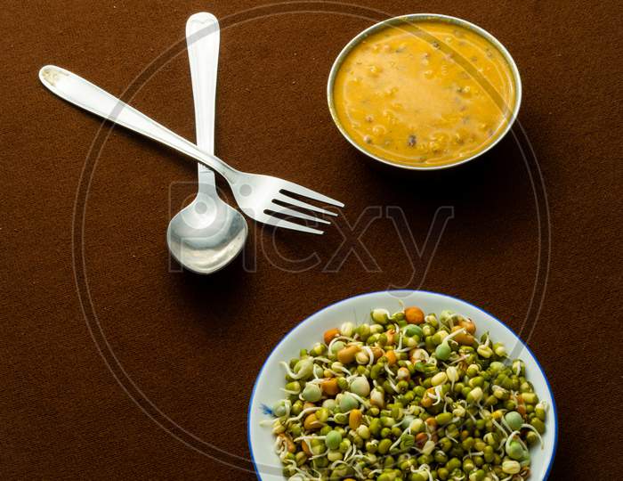 Sprouts And Its Curry On The Table
