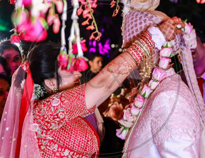 Indian Bride Putting The Garlands Around Grooms Neck