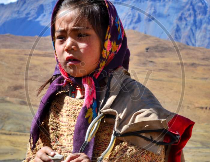 Portrait photo of a small village girl in Spiti valley