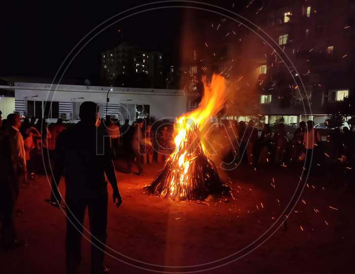 Chennai - india /TN - March 2020: people performing holika dahan the night before Holi festival