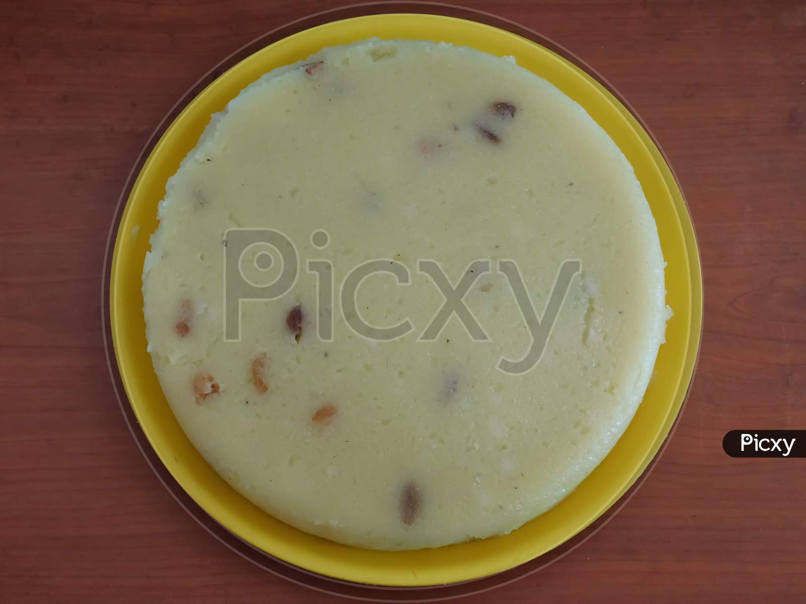 Closeup Of Delicious Sweet Dish In A Bowl Isolated On Wooden Surface