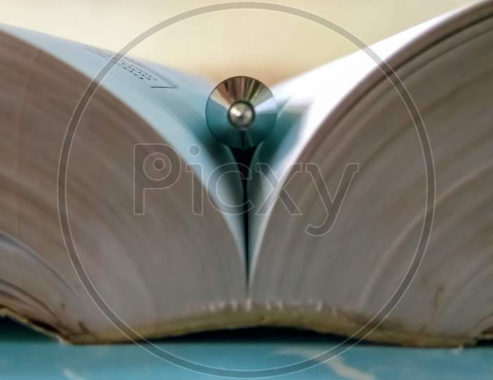 A Pen in the Middle of a Book