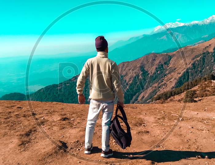 Picture Of A Boy Standing And Holding His Bag In Hands At Bir Billing (Highest Paragliding Site In India) Himachal Pradesh