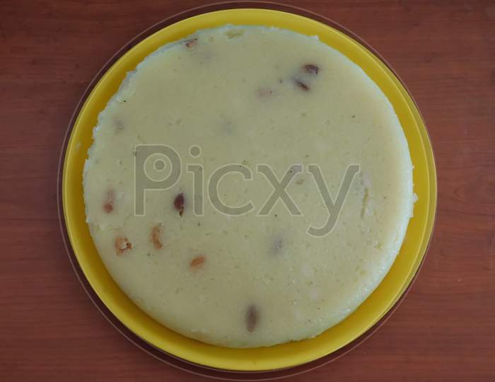 Closeup Of Delicious Sweet Dish In A Bowl Isolated On Wooden Surface