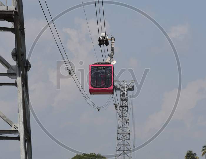 People travel on a cable car cabin in the India's longest river ropeway which connects the northern and southern banks of the Brahmaputra river in Guwahati on Oct 18,2020.