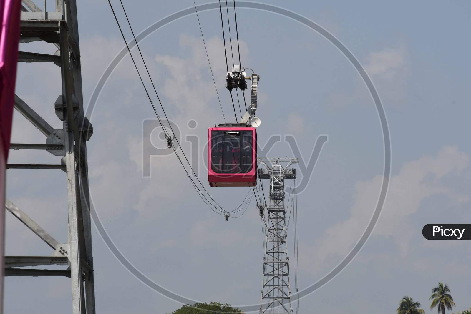 People travel on a cable car cabin in the India's longest river ropeway which connects the northern and southern banks of the Brahmaputra river in Guwahati on Oct 18,2020.